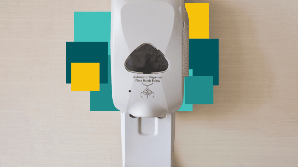 Distributeur de solution hydroalcoolique dans un couloir d'&eacute;tablissement de sant&eacute;