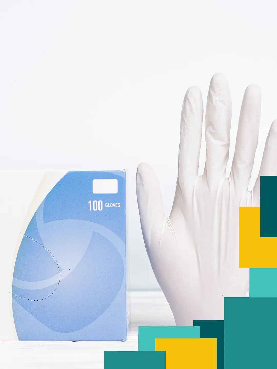 Un gant latex à côté de sa boite de distribution